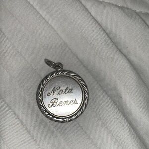 Vintage “Nota Benes” sterling silver (by Wells Sterling Co.) charm stamped